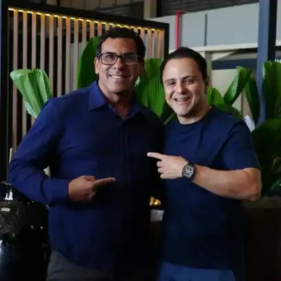 Two men smiling
