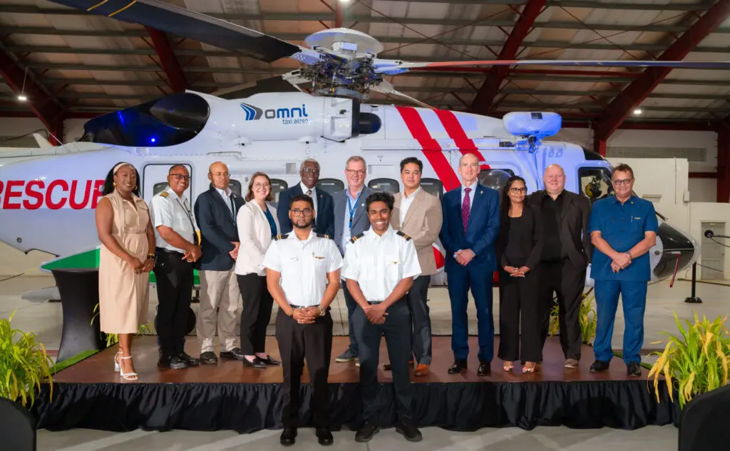 crew standing in front of helicopter